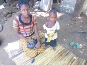 Vulnerable children receiving foodstuffs in Kaliro