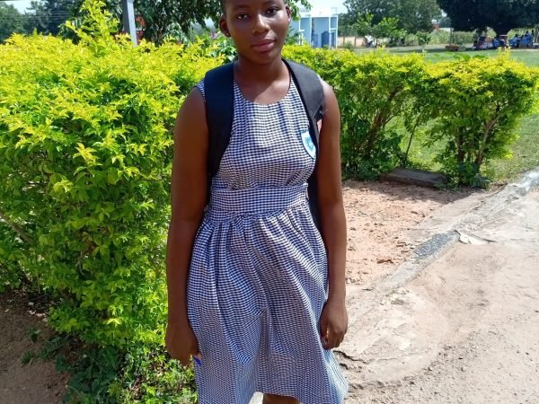 Gloria in school uniform at Kpasec