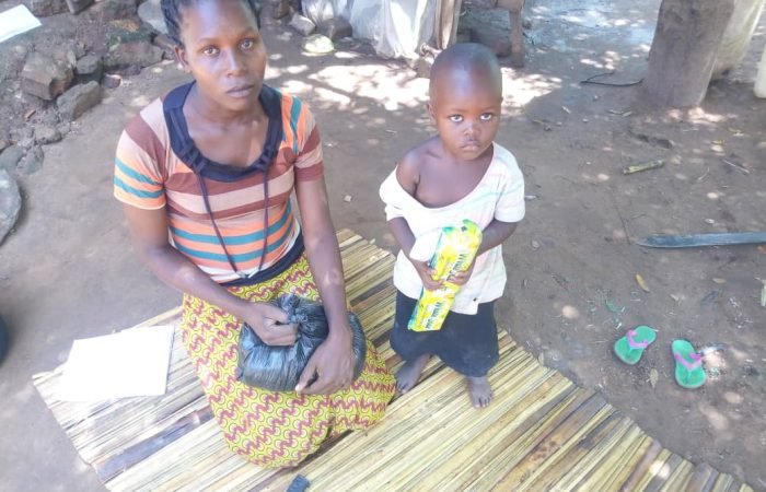 Vulnerable children receiving foodstuffs in Kaliro